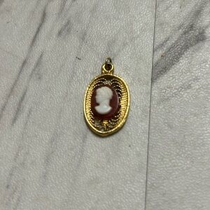 Vintage 1960s gold tone, amber and white cameo pendant